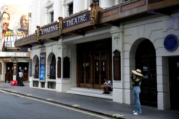 People gather outside St Martin’s Theatre in London's West End amid reopening delays - Global Banking & Finance Review