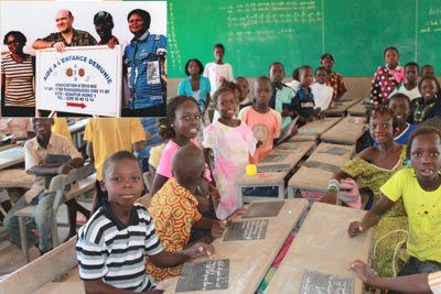 Arnaud (second left) with the team and the local school which uses the AED library
