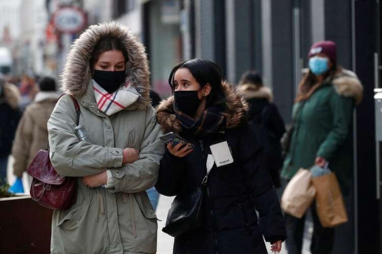 People in Brussels wearing masks amidst rising COVID-19 cases - Global Banking & Finance Review