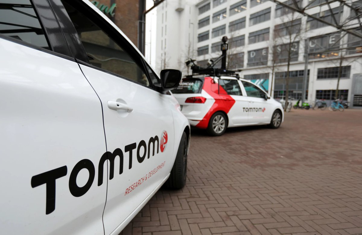 TomTom's logo displayed with declining auto sales data - Global Banking & Finance Review