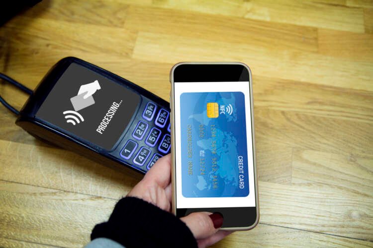 Customer making a secure payment with smartphone, highlighting PCI Forensic Investigator Certification - Global Banking & Finance Review