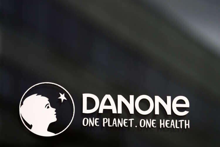 Logo of Danone at headquarters, symbolizing revenue growth in Q3 2022 - Global Banking & Finance Review