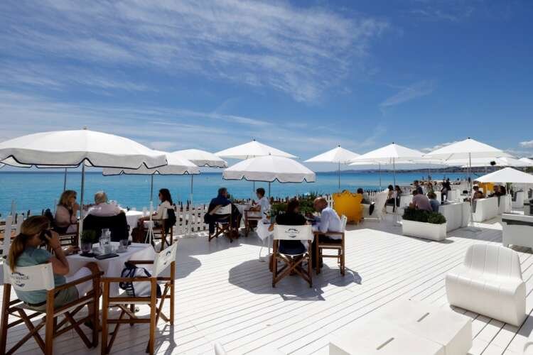Outdoor dining scene in Nice, France, reflecting Euro zone business growth - Global Banking & Finance Review