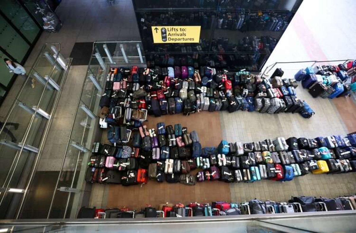 Long lines of passenger luggage outside Heathrow Airport Terminal 2 - Global Banking & Finance Review