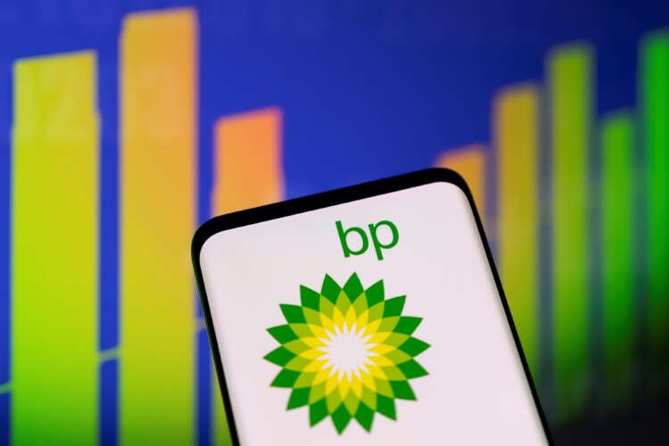 BP logo with stock graph reflecting financial impact of UK tax bill - Global Banking & Finance Review