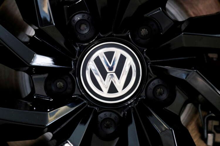 Volkswagen logo on a showroom rim cap, linked to $339 million settlement news - Global Banking & Finance Review