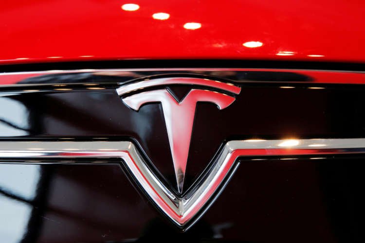 U.S. safety agency says it will gather information on Tesla-truck crash in New JerseyFILE PHOTO: A Tesla logo on a Model S is photographed inside of a Tesla dealership in New York