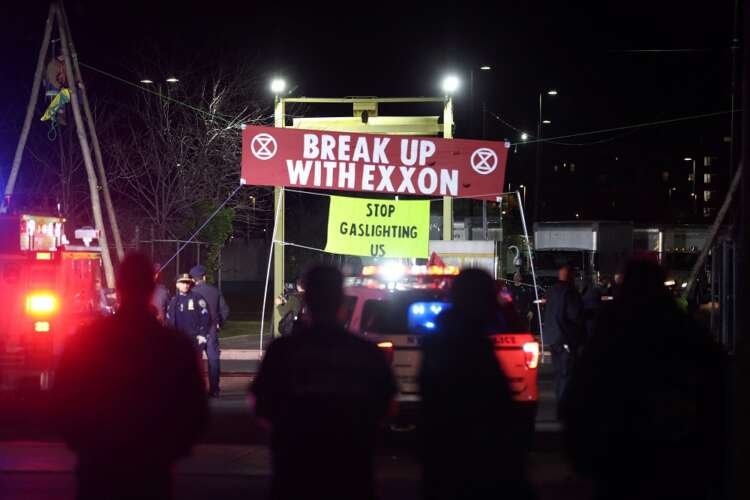 Extinction Rebellion activists blockading a New York facility for Earth Day protests against fossil fuels - Global Banking & Finance Review
