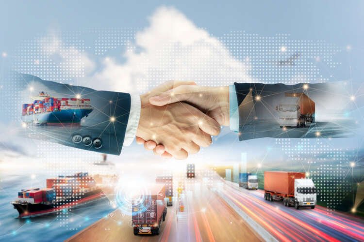 Business professionals shaking hands to symbolize partnership in merchant acquirer relationships - Global Banking & Finance Review