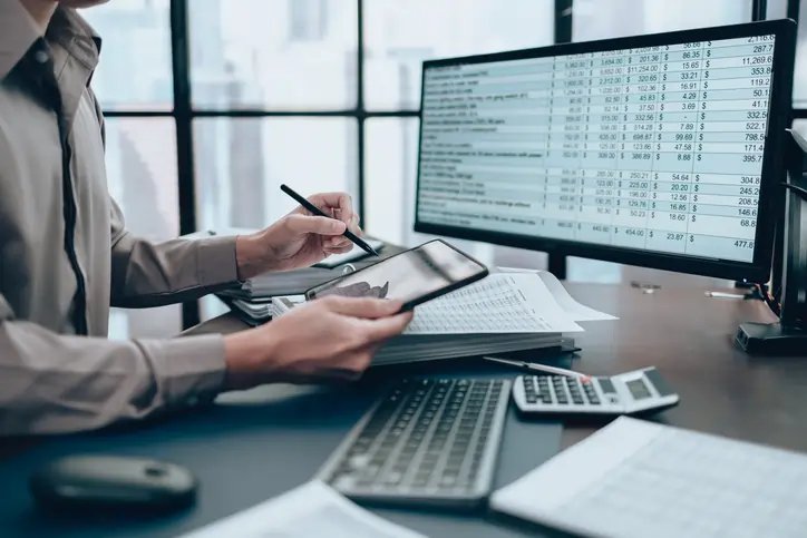 Financial professionals discussing client money reconciliations - Global Banking & Finance Review