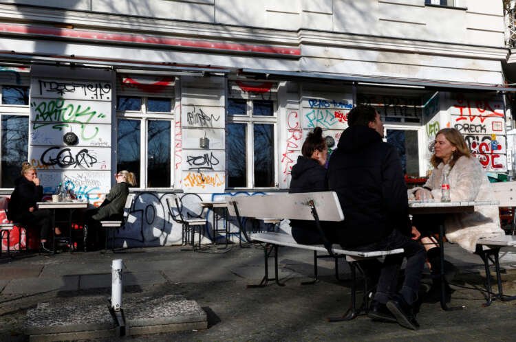 People dining outside a restaurant in Berlin amid the COVID-19 pandemic - Global Banking & Finance Review