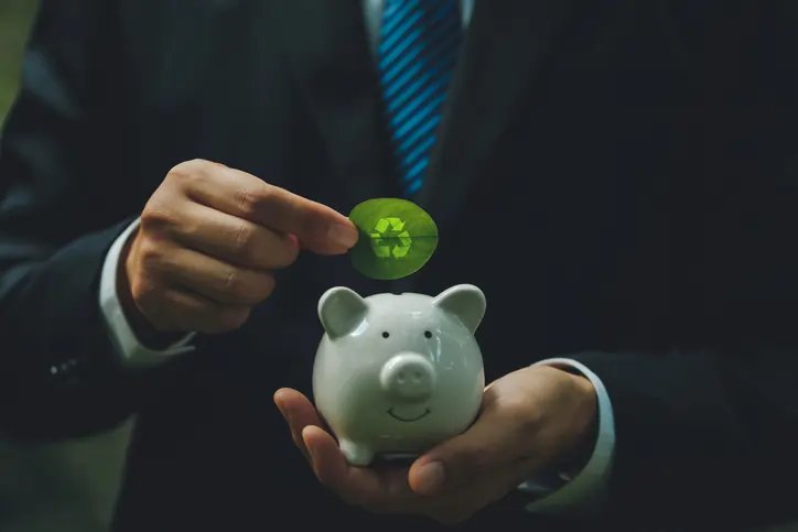 Illustration of green finance concepts with renewable energy symbols - Global Banking & Finance Review