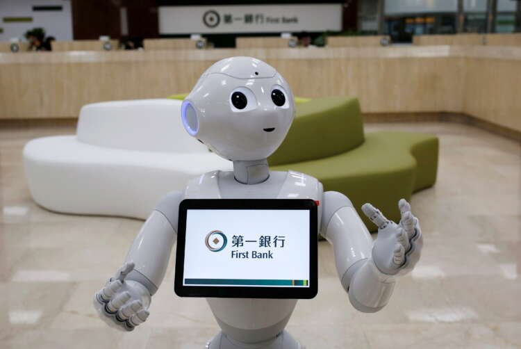 FILE PHOTO: SoftBank’s robot ‘Pepper’, is seen at First Bank branch as a concierge to welcome customers in Taipei, Taiwan