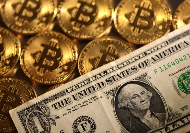 Image for Dollar ticks up before US data, bitcoin hits record high
