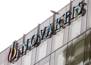 Novartis logo with a gavel symbolizing legal battles over Entresto generic - Global Banking & Finance Review