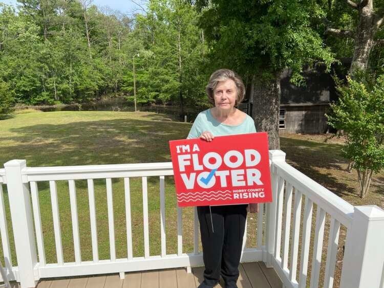 Frances Thomas, a Conway, South Carolina resident whose property has suffered from recent flooding, is pictured on her back deck on Friday, May 6, 2022. Thomson Reuters Foundation/David Sherfinski
