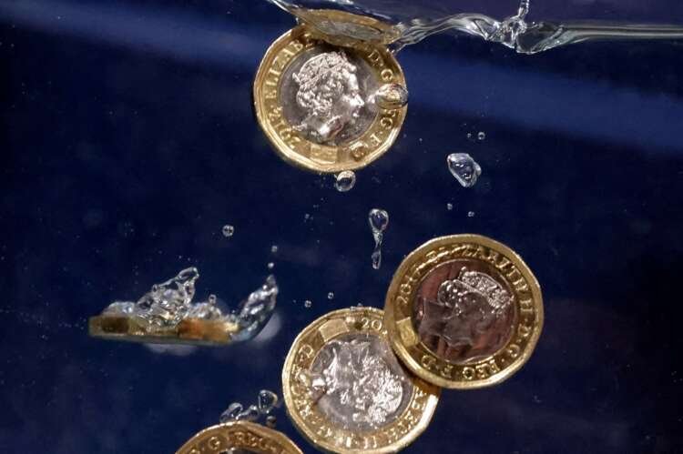 Illustration of Pound coins sinking into water, symbolizing bank fraud impact - Global Banking & Finance Review