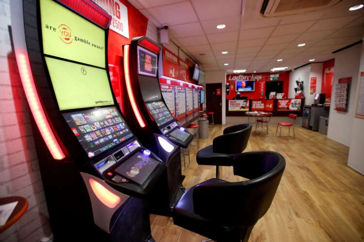 Exterior view of Ladbrokes betting shop, related to Entain's investment in gaming studios - Global Banking & Finance Review