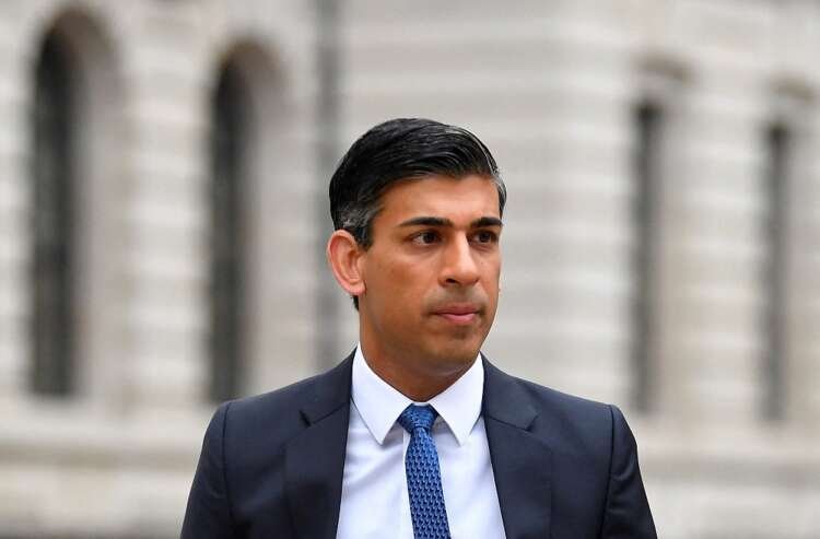 Rishi Sunak walking in London, addressing inflation issues alongside Andrew Bailey - Global Banking & Finance Review