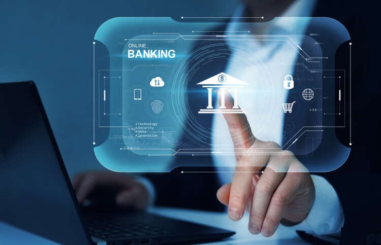 Businessman interacting with digital banking technology, symbolizing the future of banking - Global Banking & Finance Review