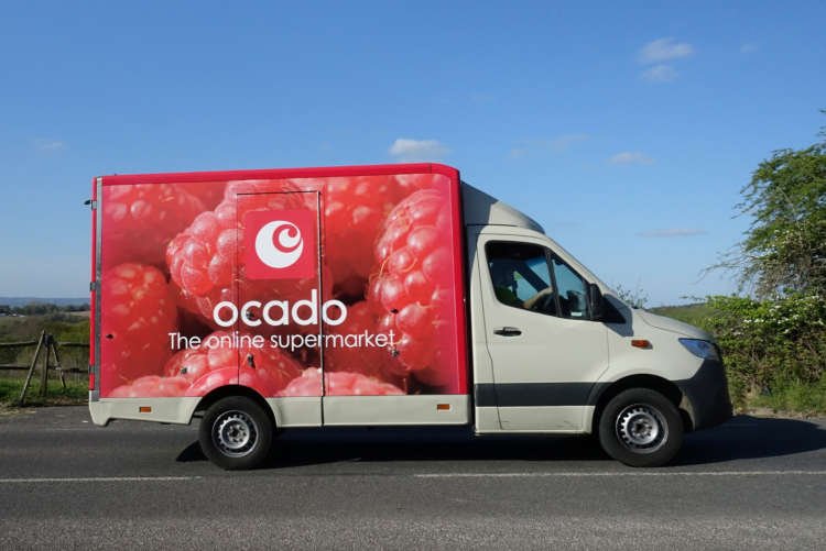Ocado delivery van during COVID-19 reflecting increased online grocery demand - Global Banking & Finance Review