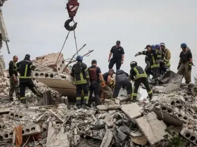 Image for Ukraine apartment block toll rises as Zelenskiy laments Russian firepower advantage