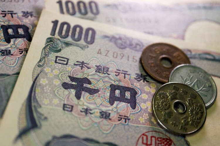 Japanese yen coins and banknotes representing currency intervention and market trends - Global Banking & Finance Review