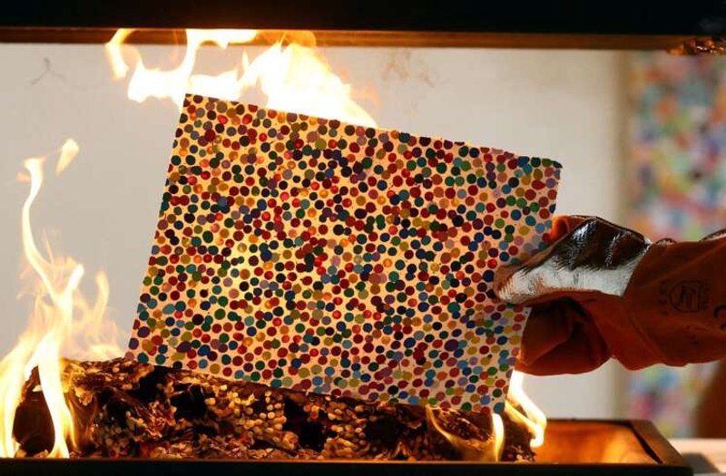 Image for Damien Hirst burns artworks after collectors pick their NFTs instead