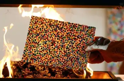 Image for Damien Hirst burns artworks after collectors pick their NFTs instead