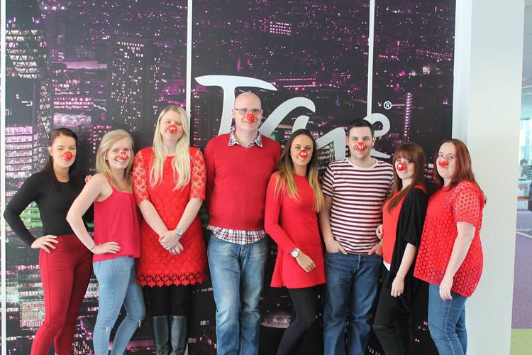 True Telecom staff celebrate raising £1000 for Red Nose Day 2015 - Global Banking & Finance Review
