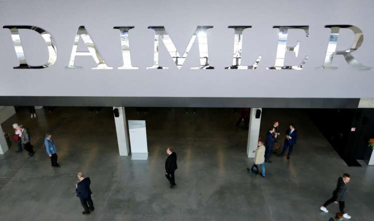 Daimler logo at shareholder meeting, reflecting Q2 earnings report - Global Banking & Finance Review