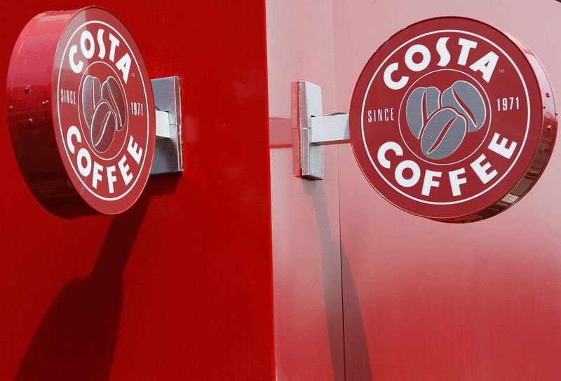 Costa Coffee workers celebrating their pay rise amid UK finance news - Global Banking & Finance Review
