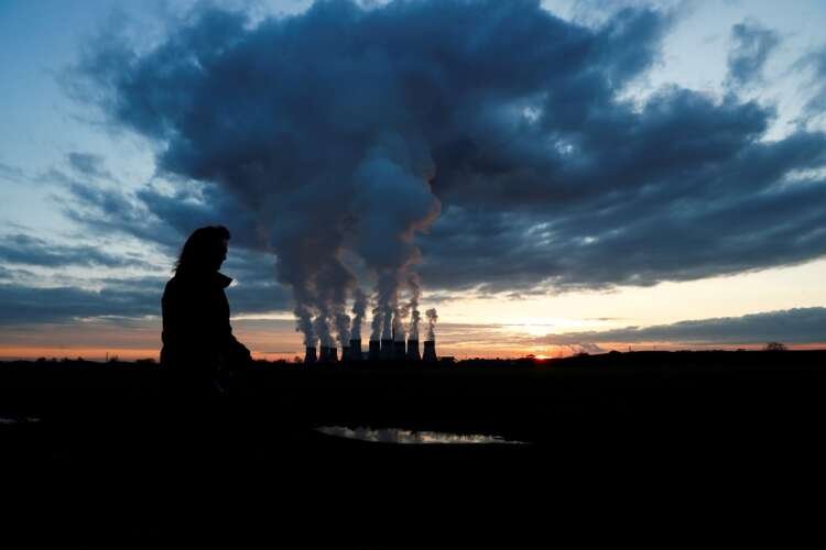 Sunset over Drax power station symbolizing carbon market reforms - Global Banking & Finance Review