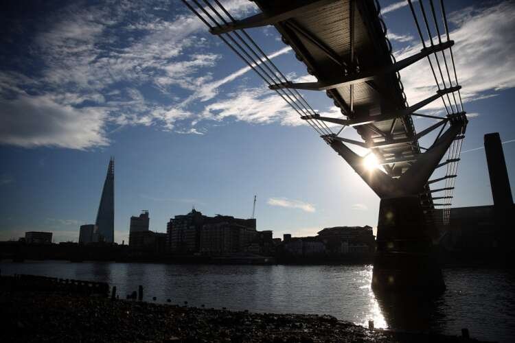 Silhouette of the Millennium Bridge in London, symbolizing UK income inequality - Global Banking & Finance Review