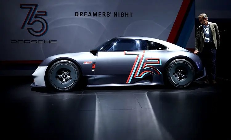 Porsche AG logo with Porsche car in foreground, illustrating delivery drop in China - Global Banking & Finance Review