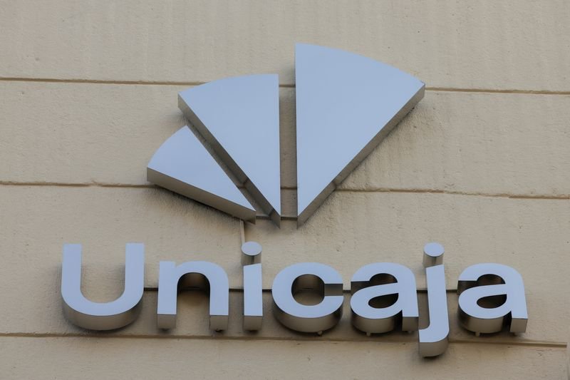 Unicaja bank logo with financial charts reflecting lower lending income - Global Banking & Finance Review