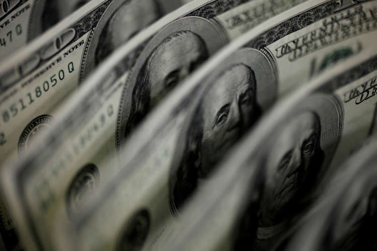 Dollar at four-week low on retreating Treasury yields