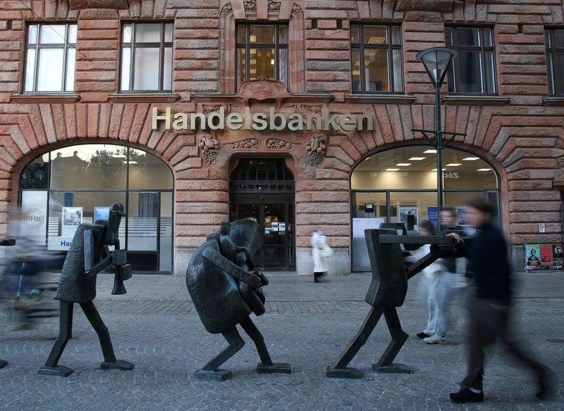 Handelsbanken logo with financial graphs representing Q4 profit results - Global Banking & Finance Review