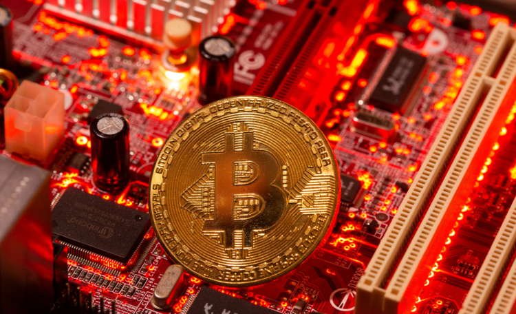 Illustration of a representation of virtual currency Bitcoin on a computer motherboard