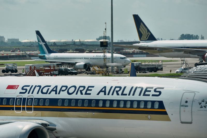 Singapore Airlines logo with infographic illustrating record quarterly revenue - Global Banking & Finance Review