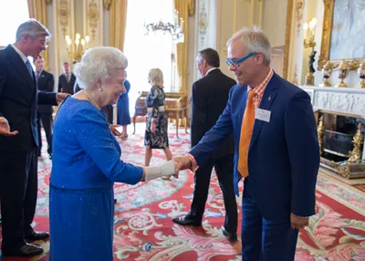Gold-i being awarded a Queen’s Award for Enterprise. The Queen and Tom Higgins CEO of Gold-i