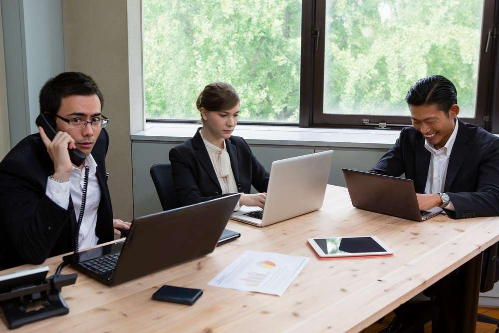 Business executives strategizing new markets during COVID-19 challenges - Global Banking & Finance Review