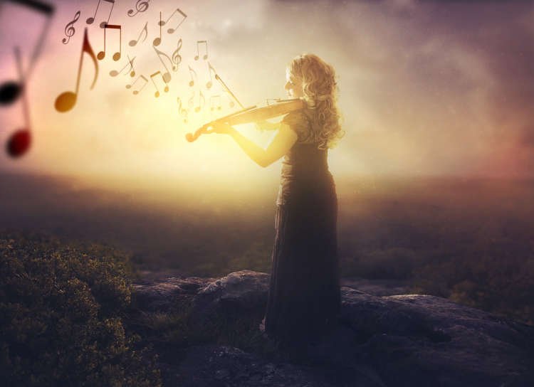 A woman with a violin playing music at sunrise, symbolizing creativity and inspiration in 2020 - Global Banking & Finance Review