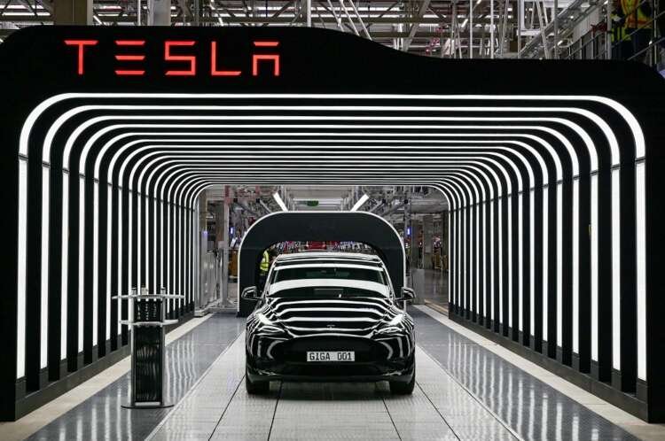 Tesla factory showcasing electric vehicle production amidst supply chain issues - Global Banking & Finance Review