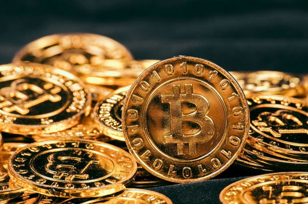 Bitcoin investment guide with cryptocurrency symbols and digital wallet concept - Global Banking & Finance Review