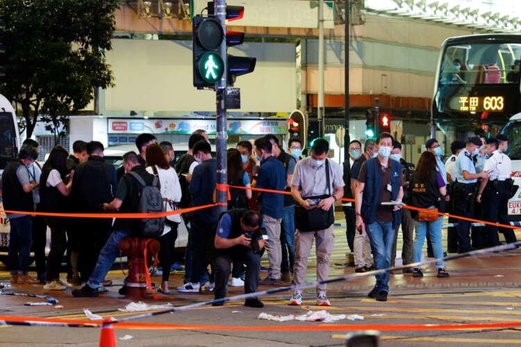 Police investigating the scene of a stabbing attack on an officer in Hong Kong - Global Banking & Finance Review