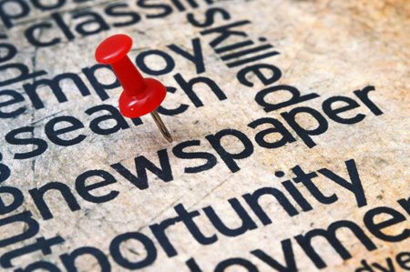 pushpin on newspaper text z