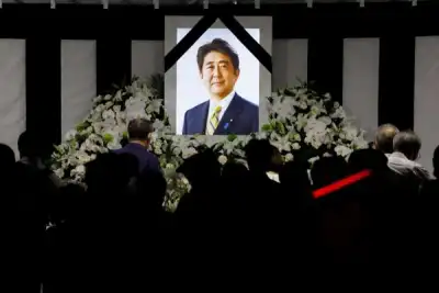 Image for With flowers and a gun salute, Japan bids farewell to divisive Abe