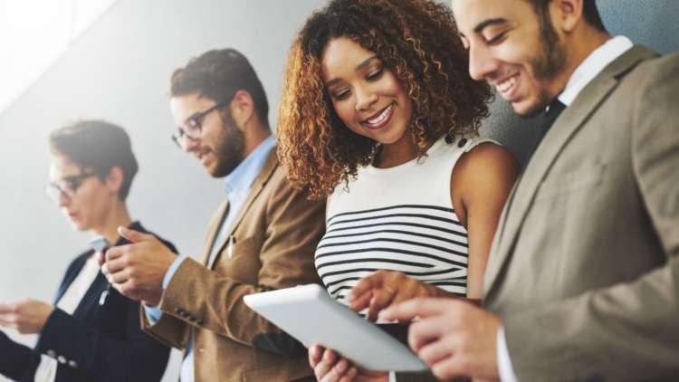 Business professionals analyzing digital engagement trends in the UK - Global Banking & Finance Review