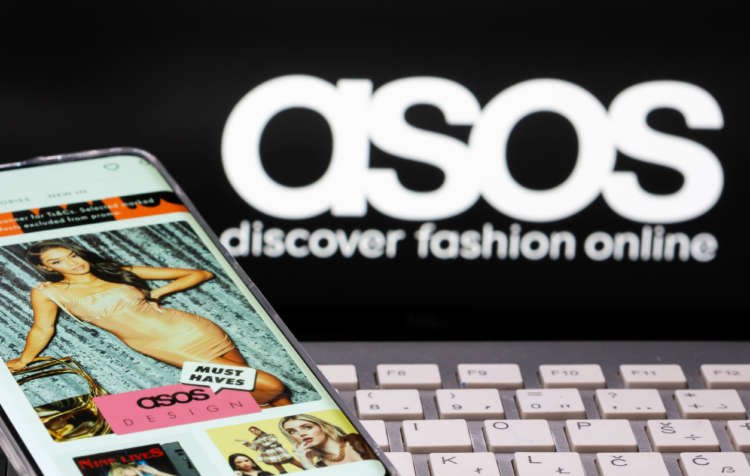 Smartphone displaying the ASOS app with ASOS logo, reflecting strong demand during pandemic - Global Banking & Finance Review